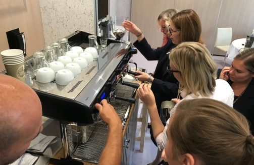 Guests make coffee at giant barista machine'